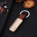 lose-up of mini keychain lighter leather loop and steel keyring attachment