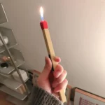 Close-up of red match head tip on wooden soft flame stick lighter