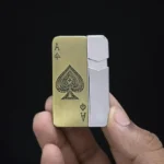 Close-up of detailed Ace of Spades engraving on the metal lighter