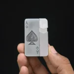 Silver Ace Metal Jet Torch Lighter held in hand showing Ace of Spades engraving