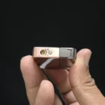 Bottom view of Ace Metal Lighter showing butane refill valve